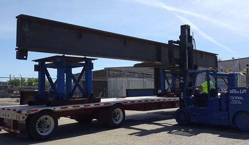 Doral machine transporting a structural steel mainframe