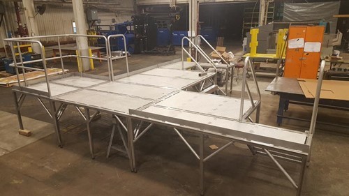 Fabricated stainless steel platform in a warehouse space