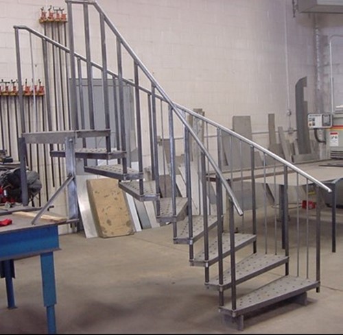 Custom metal staircase in a warehouse space