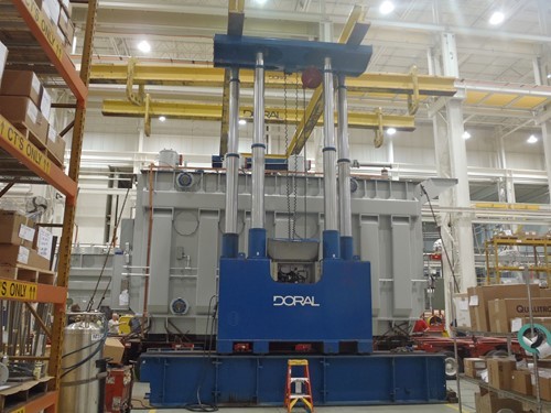 A Doral gantry crane lifting a 300,000-lb. transformer in a plant