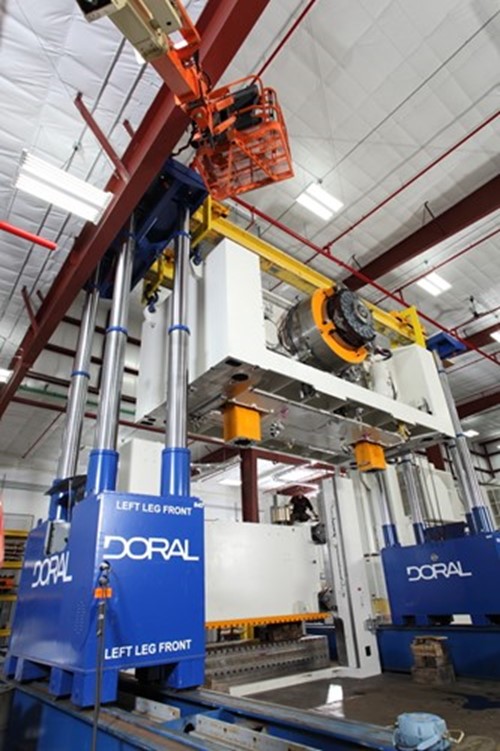 Doral lifts stacking a crown on a stamping press