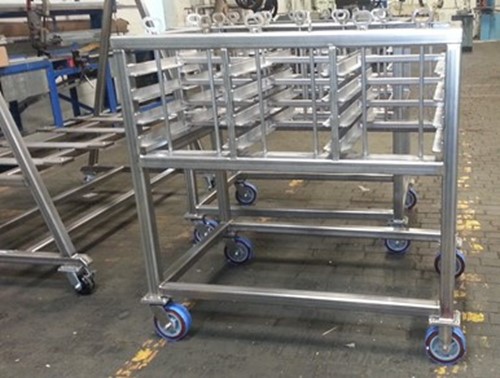 Stainless steel racks on wheels in a plant