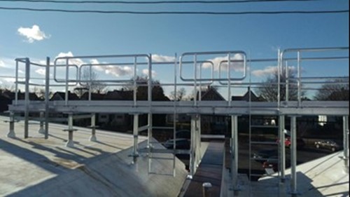 Galvanized steel cat walk platform on a building