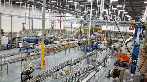 Overhead view of a conveyor system for a bottle line set up in a plant