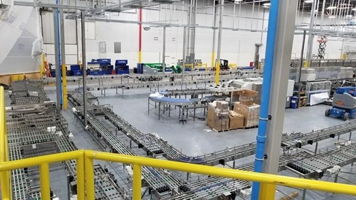 Overhead view of a conveyor system for a bottle line set up in a plant