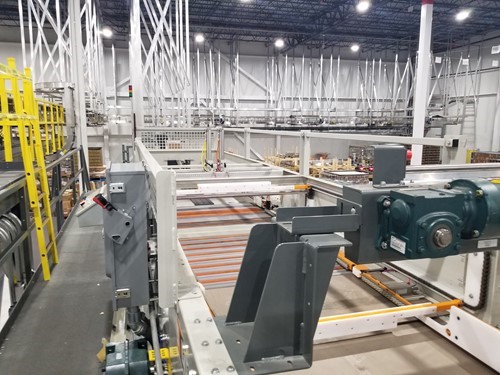 View of a conveyor system in a food processing and packaging plant